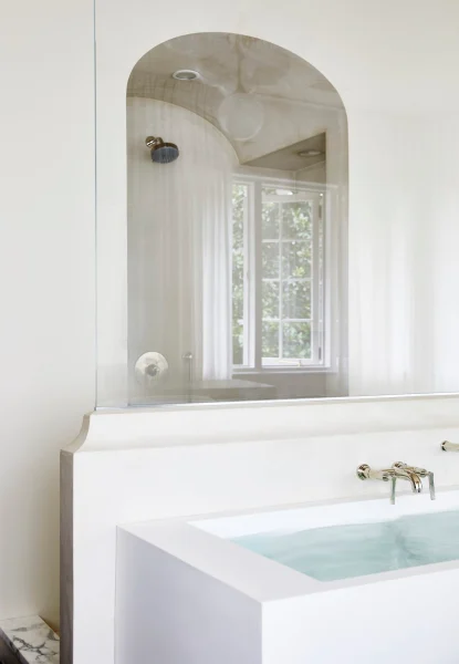 tub with reflection of shower