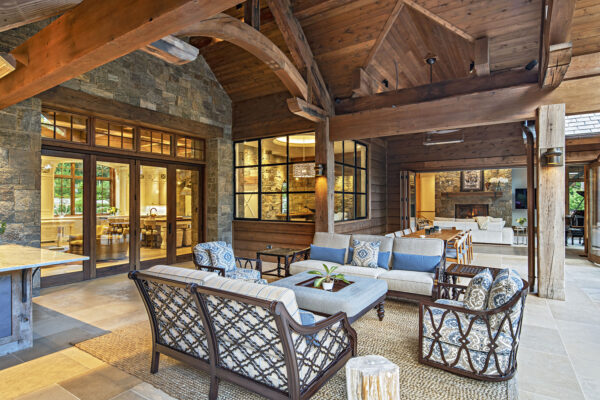 back porch design with sitting area and dining table