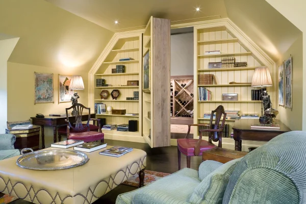 wine vault open behind bookcase