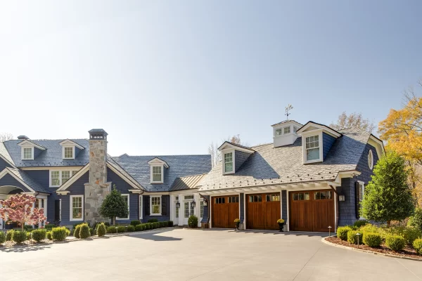 three car garage blue exterior home Waxhaw NC